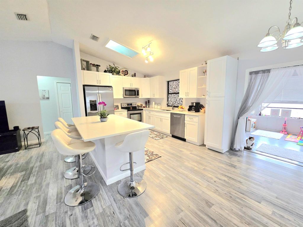 Photo of 749 SE Atlantus Avenue, Port Saint Lucie, FL 34983 (MLS # R11089166)