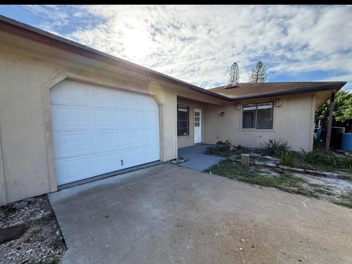 WELCOME TO THIS LOVELY DUPLEX IN EAST HOBE SOUND. THIS UNIT HAS BEEN FRESHLY UPDATED WITH A NEW KITCHEN AND BATHROOMS. TILE THROUGHOUT. 1 CAR ATTACHED GARAGE. LOTS OF STORAGE WITH WALK IN CLOSETS AND ATTIC SPACE. PLENTY OF PARKING IN THE EXTRA LONG DRIVEWAY. SMALL PETS WELCOME WITH A $250 FEE PER ANIMAL. FIRST, LAST AND SECURITY TO MOVE IN. WELL WATER WITH FILTRATION SYSTEM, SEPTIC TANK & LAWN INCLUDED IN RENT. PRIVATE LAUNDRY ROOM ON PATIO. RAPID APPROVAL