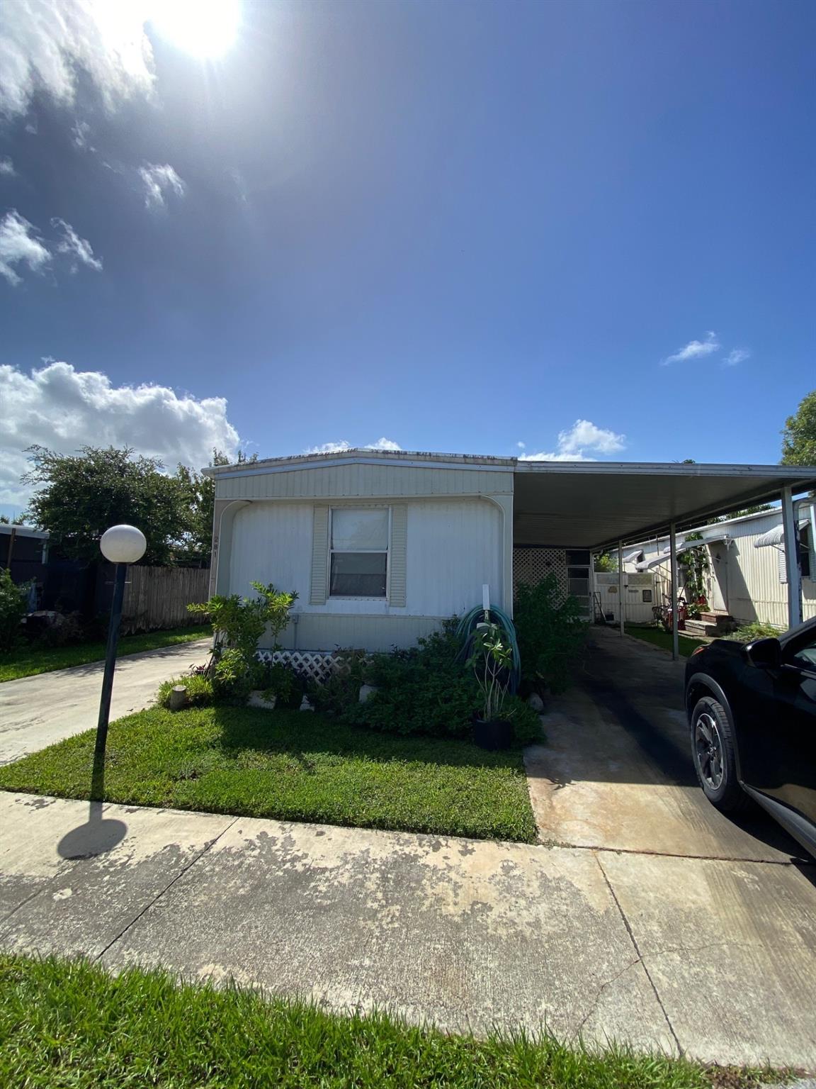 Spacious 2 bedroom 2 bath single wide with carport. Just needs your personal touch to make it your next home. Family community that offers 2 pools, children's playground, recreattion center with exercise equiptment. High school within walking distance.