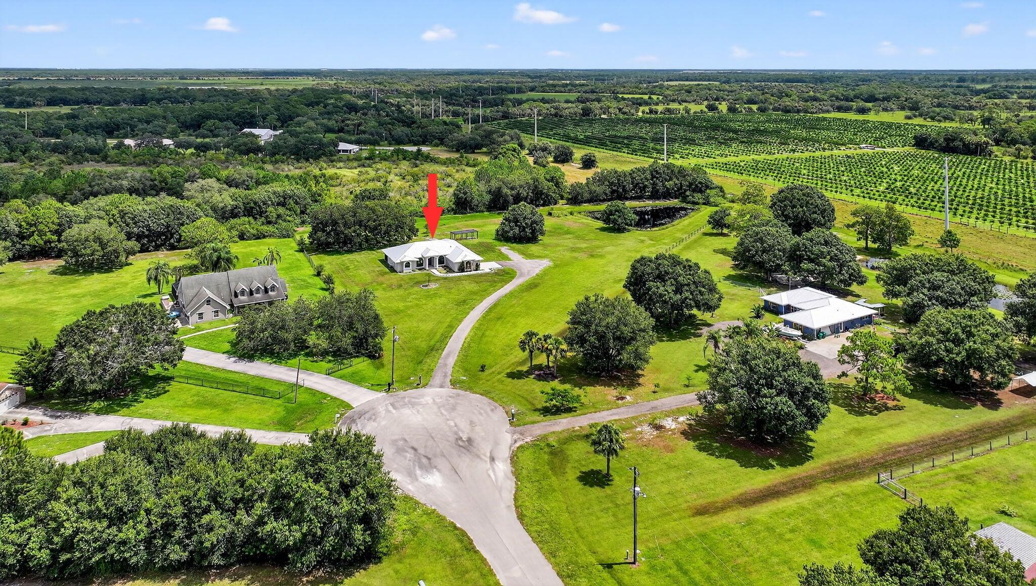 SITED ON A 3.36 ACRE CUL-DE-SAC RES/AG LOT W/PRIVATE FISHING POND. ENJOY THE PEACE AND TRANQUILITY OF COUNTRY LIFE NEIGHBORING PROTECTED WETLANDS AND AN ORANGE GROVE. TRANSFORMED SINCE 2021: METAL ROOF, IMPACT WINDOWS AND DOORS, KITCHEN CABINETS W/QUARTZ COUNTERTOPS, SS REFRIGERATOR, SS DISHWASHER, 48'' SS PRO STYLE DUAL FUEL RANGE W/DUAL OVENS AND GRIDDLE. 7' WIDE REACH IN PANTRY W/ APPLIANCE COUNTERTOP. LIVING AREA AND PRIMARY BEDROOM FEATURE ENGINEERED WOOD FLOOR W/CARPET IN GUEST BEDROOMS. ALL NEW 5'' BASEBOARDS/TRIM. EVERY OUTLET AND SWITCH HAS BEEN UPDATED. 120# PROPANE TANK FUELS 2022 TANKLESS WATER HEATER, 2022 DRYER AND COOKTOP. HOME IS GENERATOR READY WITH SAFETY BREAKER. 2022 IRON BREAKER TANK-2024 1HP WELL PUMP. PROPERTY IS ZONED RES/RURAL-BRING YOUR LIVESTOCK. XFINITY IS HERE