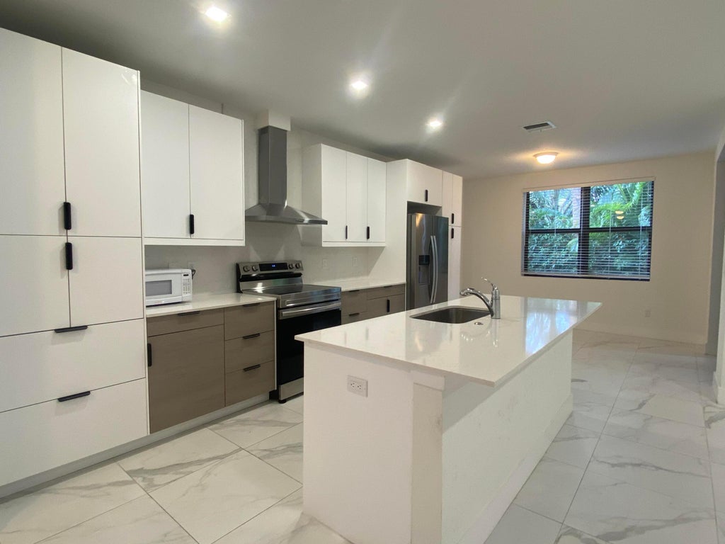Photo of 383 Bella Sol Way, West Palm Beach, FL 33406 (MLS # B26080665)