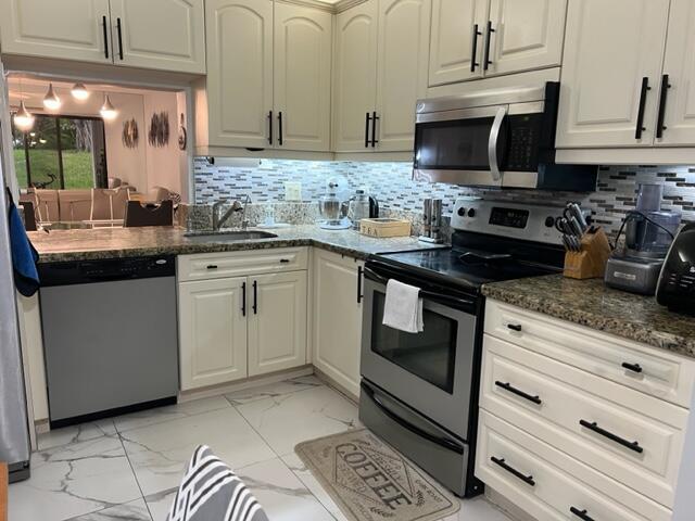 MOTIVATED SELLER - Renovated Kitchen, New Tile Floor, New bathrooms, 1,150 Sq Ft, First Floor, Large Front Patio Fully Fenced. This home is located in the vibrant Township Community Association, offering access to incredible amenities like a 2-story fitness center, performing arts center, aquatic center, sports center, racquet club, recreational complex, and a long picturesque walkway & bicycle path around the lake. In fact, this ground floor unit has 2 sheds for your bikes and all your tools!