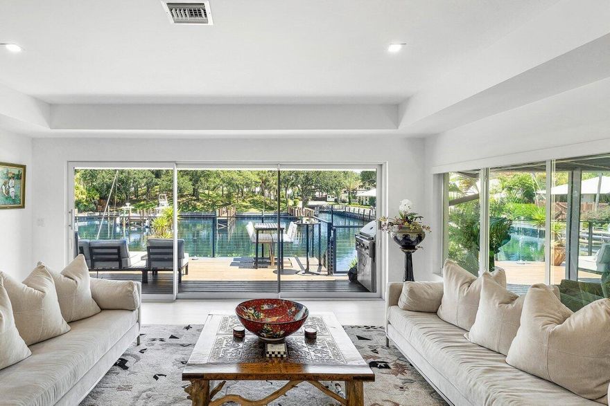 A rare offering in Boca Raton's premier deepwater yachting community, this impeccably reimagined single-story 3-Bdrm, 3-Ba Villa boasts 40 feet of private dockage, wide-water views and direct ocean access w/ no fixed bridges. Designed for the discerning yachtsman, the residence lives like a private home, complete w/ a 2-car garage & the security of a manned, gated enclave.  Completely rebuilt with no detail overlooked, the home features a chef's kitchen with a generous island, Wolf appliances, dual dishwashers & a natural gas cooktop--ideal for both entertaining and everyday living. A climate-controlled, 1,250-bottle wine cellar caters to the true connoisseur.  The tranquil primary suite offers spa-like indulgence, with glass rain shower, deep soaking tub, and bespoke finishes.