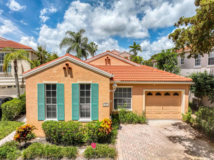 Nestled within the sought-after community of Villa d'Este, this meticulously maintained 3BR/2BA single-story residence offers inviting living spaces and a light, airy ambiance throughout. Neutral stone-look tile, a soothing ecru palette, skylights, large windows, and sliding doors fill the home with natural light and warmth. The open-concept layout seamlessly blends the living, dining, and kitchen areas, anchored by a cozy gas fireplace with stone surround and wood mantle. The kitchen is appointed with chestnut-toned cabinetry, quartz countertops, stainless steel appliances, and a gas range. The spacious primary suite offers screened patio access, generous closet space, and an updated en-suite bath. Enjoy Florida living year-round from the screened patio with retractable awning, perfect for relaxing or entertaining.