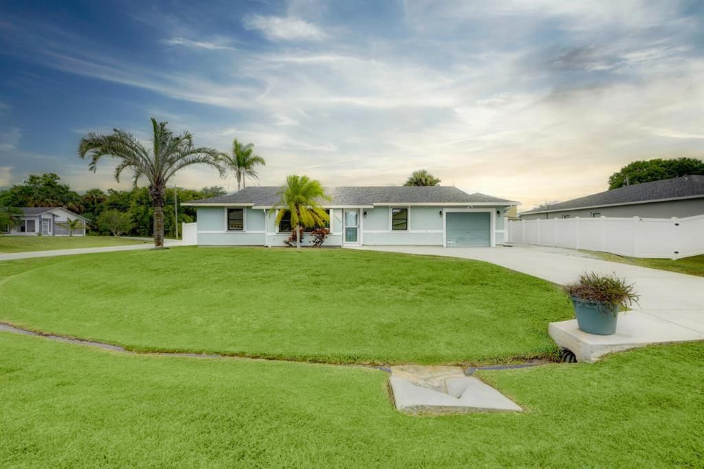 Photo of 1002 SW Sarto Lane Ln, Port Saint Lucie, FL 34953 (MLS # R10815047)