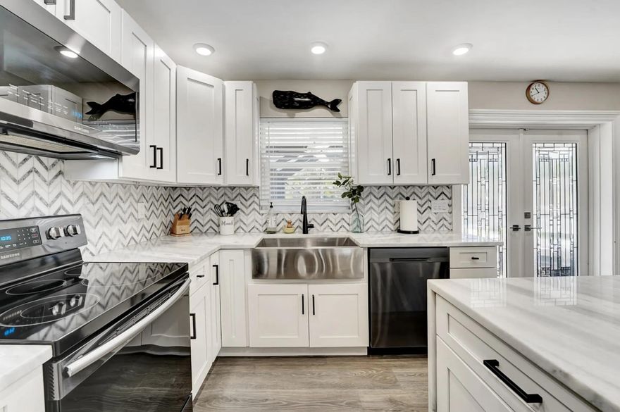 Discover the perfect blend of coastal luxury and modern comfort in this stunningly remodeled 4-bedroom, 2-bath Boca Raton home. From the moment you step inside, you're greeted by a bright, open-concept living space designed for effortless entertaining and everyday living. The spectacular chef's kitchen is the heart of the home, featuring a large island with ample seating, ready for everything from morning coffee to lively evening gatherings. Step outside into your private, sun-drenched paradise! Make a splash in the fully renovated, heated saltwater pool - your year-round ticket to fun and relaxation. Host unforgettable barbecues or simply unwind in your secluded backyard oasis. This home is not just beautiful, it's built for peace of mind with a newer roof and full hurricane impact windows. Both bathrooms have been exquisitely renovated with designer touches, creating a spa-like retreat.
Perfectly positioned just a mile from the beach, a short stroll to houses of worship, and moments from the world-class shopping and dining at Mizner Park. For the ultimate convenience, this incredible home can be sold fully furnished - just bring your sunglasses! Don't miss this opportunity to live the quintessential South Florida lifestyle. Schedule your private showing today!