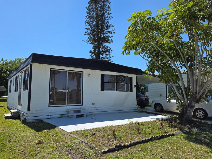 This 2 bed,2 bath is a handyman special and nestled in a quiet 55+ community on the water! Beautiful, spacious yard area with spectacular water views. This home is perfect for a serene retreat or entertaining guests. Located minutes from the beach, this home offers the best of coastal living & convenience;1-2 miles from grocery store, bank, pharmacy, post office & more. Whether you're looking for a peaceful retirement spot or a cozy beach getaway, this home provides comfort, style, in an unbeatable location. Don't miss out! Land lease of 910.60 includes private golf course (no fees to play) pool, fitness, pickleball, tennis, shuffleboard, bocce, gym, library, cards, Mah Jong, bible study, wood workshop, golf cart parades, dinners, dances, trips & more. Lawn cutting & trash included.