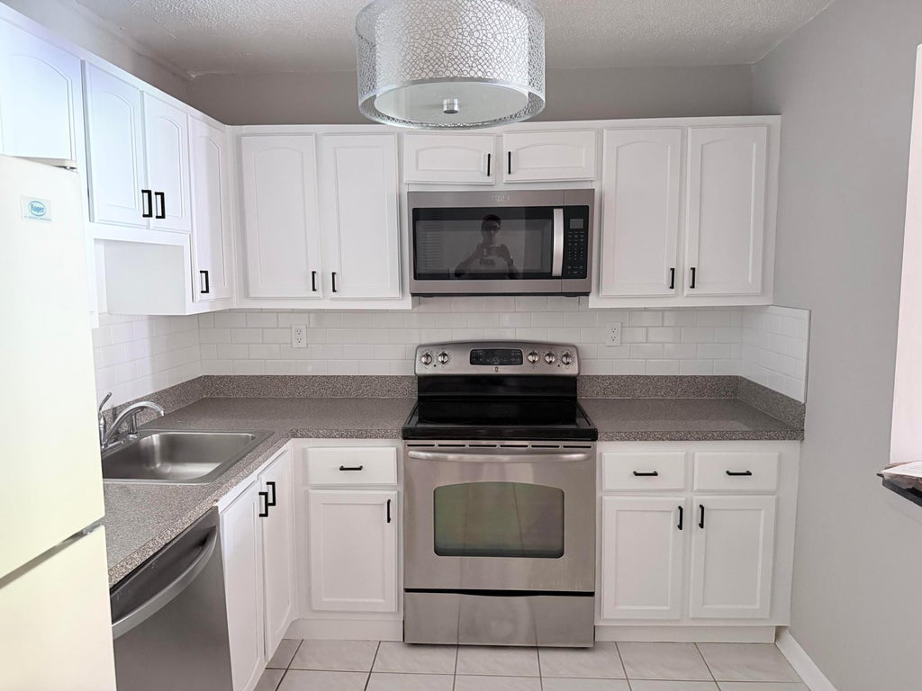 Photo of 9370 SW 8TH Street #214, Boca Raton, FL 33428 (MLS # B26078152)