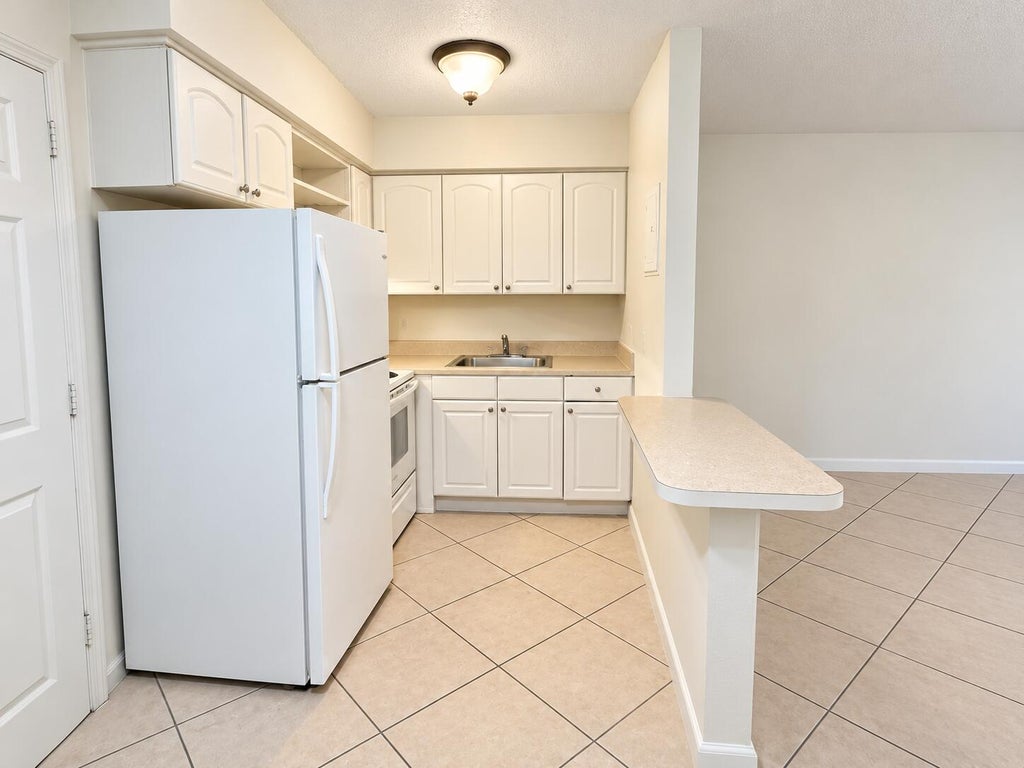 Photo of 1960 NE 48 Street #11, Pompano Beach, FL 33064 (MLS # B26080548)