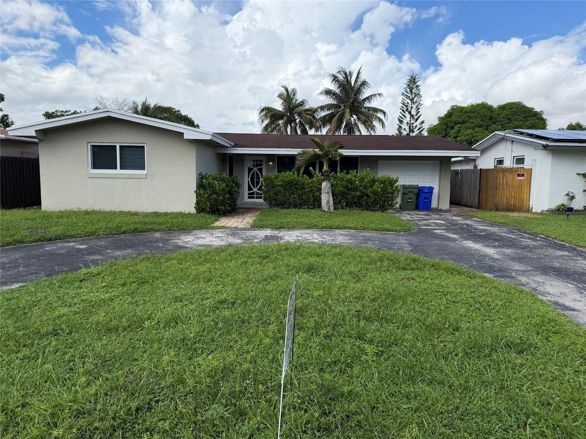 Spacious 4-bedroom, 2-bathroom home in Pembroke Pines featuring tile floors throughout, a modern kitchen with stainless steel appliances, and updated bathrooms. Bright open layout with large living areas. Enjoy a spacious backyard with lake views, perfect for relaxing or entertaining. Conveniently located near schools, shopping, dining, and major highways.
