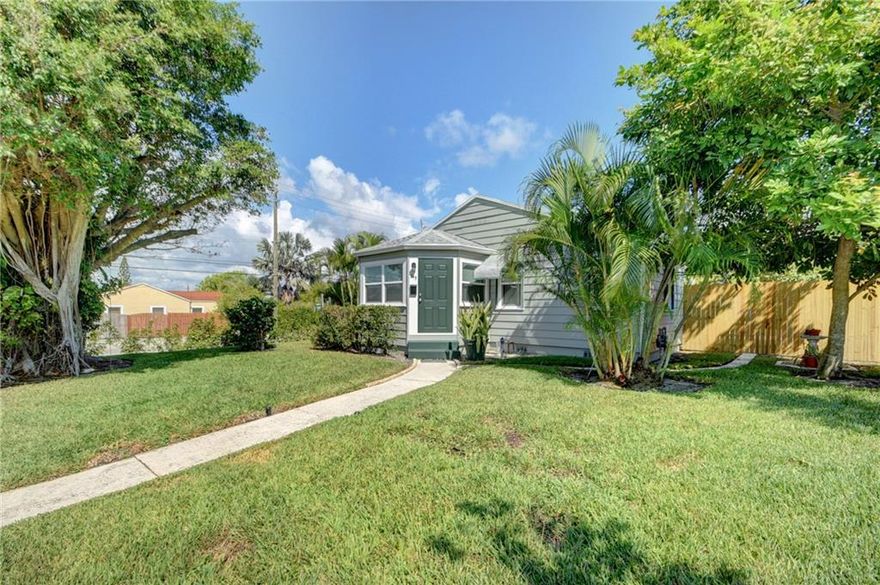 CHARMING, substantially renovated beauty! new ROOF, new IMPACT windows, original gorgeous hardwood floors, new kitchen, new appliances, new A/C, new tankless water heater.  This is almost a brand new home with the essence & style of the 1940 architectural integrity intact. Beautiful archways & beams which adorn the ceiling.  Classic, original pocket french doors.  Breathtaking beauty with all the character of the era.  The home sits on nearly a quarter of an acre. No HOA, no restrictions.  Room for a pool, an in law suite or ADU. Located just moments from the ocean, downtown, dining, cultural events, the Palm Beach Int'l airport. This is a true gem. Private showings by appointment.