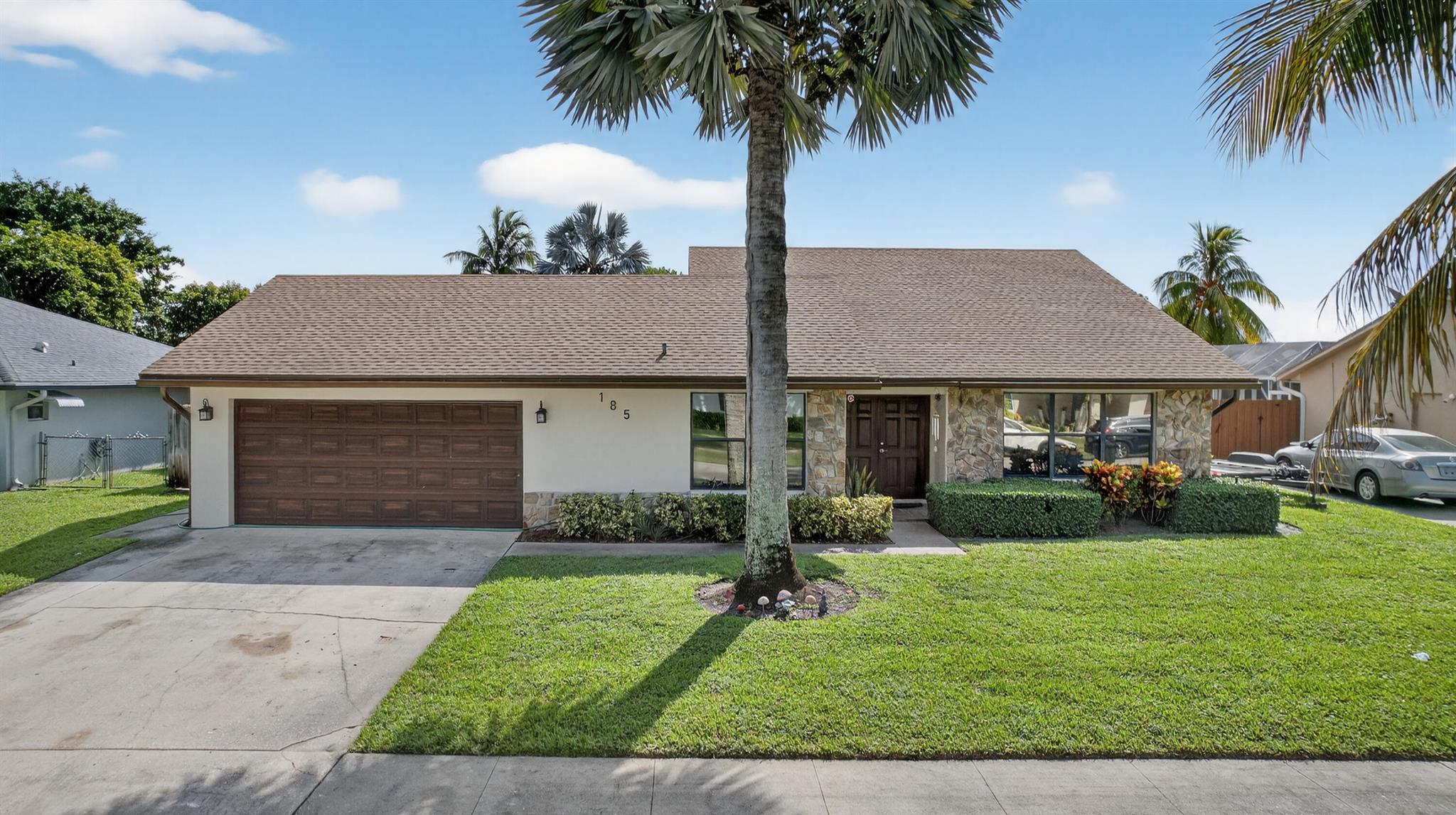 Welcome to your dream home in Royal Palm Beach! This fully renovated 3-bedroom, 2-bath residence is move-in ready with a brand-new roof (2025), new AC (2025), and updated bathrooms (2024). The stunning kitchen, remodeled in 2022, features quartz countertops, modern cabinetry, and stainless steel appliances. Enjoy ceramic tile floors, an open layout, and an abundance of natural light. Step outside to a 12,000+ sq ft backyard perfect for entertaining. Home can be purchased fully furnished for an additional price for a complete move-in ready lifestyle, conveniently near shopping, dining, parks, and top schools.