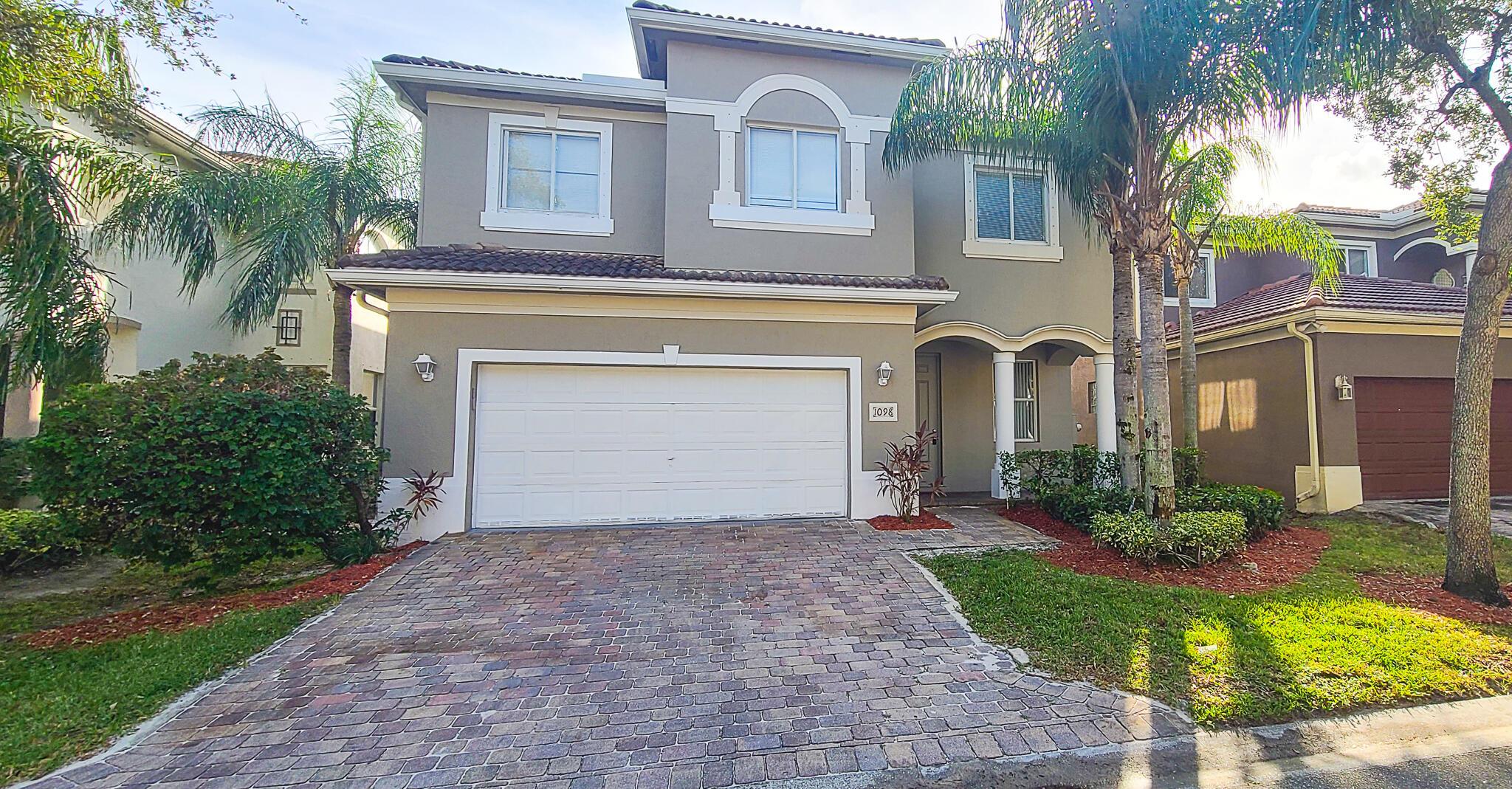 RARE FIND IN PALM BEACH!! YOU CAN WORK FROM ANYWHERE, WHY NOT A LAKEFRONT PARADISE!! 5 BEDROOMS/3 BATHS! GATED COMMUNTIY. BRICK PAVER DRIVEWAY AND TWO-CAR GARAGE. AS YOU ENTER THE HOME THE FORMAL LIVING AND DINING AREA GREET YOU. ALL FIVE BEDROOMS ARE LOCATED ON THE SECOND FLOOR ALONG WITH 3 BATHROOMS AND LOFT AREA. THE FIRST FLOOR HAS A HALF BATH. FIRST FLOOR IS TILED W/BEAUTIFUL TUSCANY CERAMIC TILE! BAMBOO FLOORING ON THE STAIRS & ENTIRE 2ND FLOOR-ALL ROOMS! THE BATHROOMS ARE FINISHED IN OFFWHITE/BEIGE CABINETRY, TILE AND CULTURED MARBLE TOPS. GUEST BATHS FEATURE A TUB/SHOWER COMBINATION. MASTER BATH FEATURES WOOD CABINETRY, GARDEN TUB AND SEPARATE SHOWER. HE BACKYARD FEATURES A SMALL STEPPING PATIO OVERLOOKING LAKE. COMMUNITY POOL!
