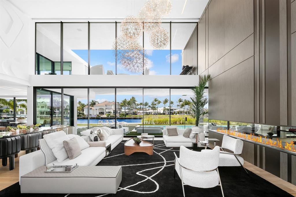 As seen on CNBC, transcend the expected at this award-winning new contemporary masterpiece brilliantly staged in Boca Raton's prestigious Estates. The trophy waterfront mansion, part of an exclusive enclave of luxury properties on a barrier island between the Intracoastal Waterway & the Atlantic Ocean, dazzles with architectural originality, exquisite craftsmanship & artful splendor. The architectural award-winning statement from Alex Penna, the Senior Designer & Principal of Studio KHORA. Bridges the worlds of light, space, texture & form to create an inspired visual experience unique to the luxury residential scene in south Palm Beach County. The epic two-story layout, encompasses nearly 10,000 square feet of living space with more than 15,000 square feet overall in a gated setting.