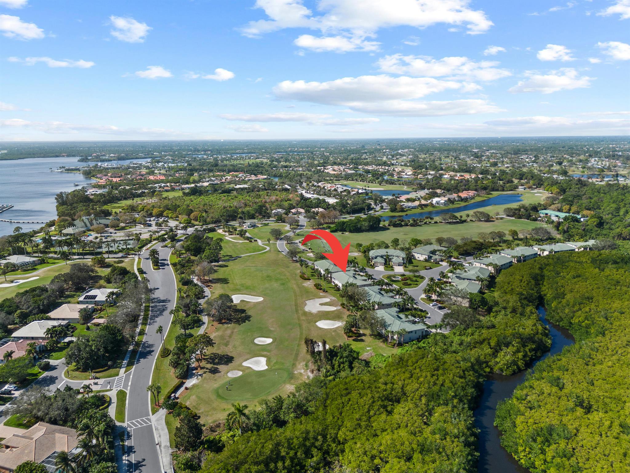 This beautifully renovated 1st-floor villa with golf course views from its screened lanai. Upgrades include impact windows & doors, fresh interior paint, custom kitchen pull-outs, soft-close cabinetry, pantry, quartz countertops, remote-controlled lighting, stainless appliances, & two appliance garages. The sunlit open floorplan features a split-bedroom layout for privacy, plus a versatile den that can serve as a 3rd bedroom. The coastal-inspired primary bath offers a walk-in shower & jetted tub. The primary suite includes new tile flooring and two walk-in closets. Deep garage accomodates a car & golf cart. Santa Lucia River Club membership is optional, offering golf, tennis, heated pool, fitness center, clubhouse, marina, & fine dining. Convent to shopping, restaurants & beaches.