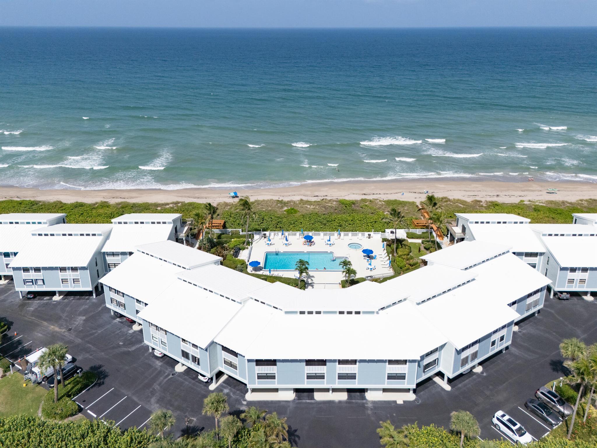 This Beachwood Villa offers a newer renovation and beautifully designer furnished, totally turnkey! This condo is best described as Luxury Living meets Luxury Coastal. Impact windows and sliders with Hunter Douglas motorized shades, with nice large balcony porch with magnificent views overlooking the Ocean. Steps away from the pool and hot tub and a short walk to direct access to the Beach. Covered carport and additional storage in ground level.Move in ready with top of the line appliances, this condo doesn't skip a beat! From all Kitchenware, Bedding, TV's and more.............just bring your toothbrush!Desirable location, close to great fine dining, and close to Stuart Downtown. This unit, will not last!