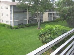 Desirable corner unit in Century Village in Boca Raton. Very light and bright. Tiled throughout with completely open kitchen to offer a larger living area.Overlooking a quiet garden area. This is a furnished unit.