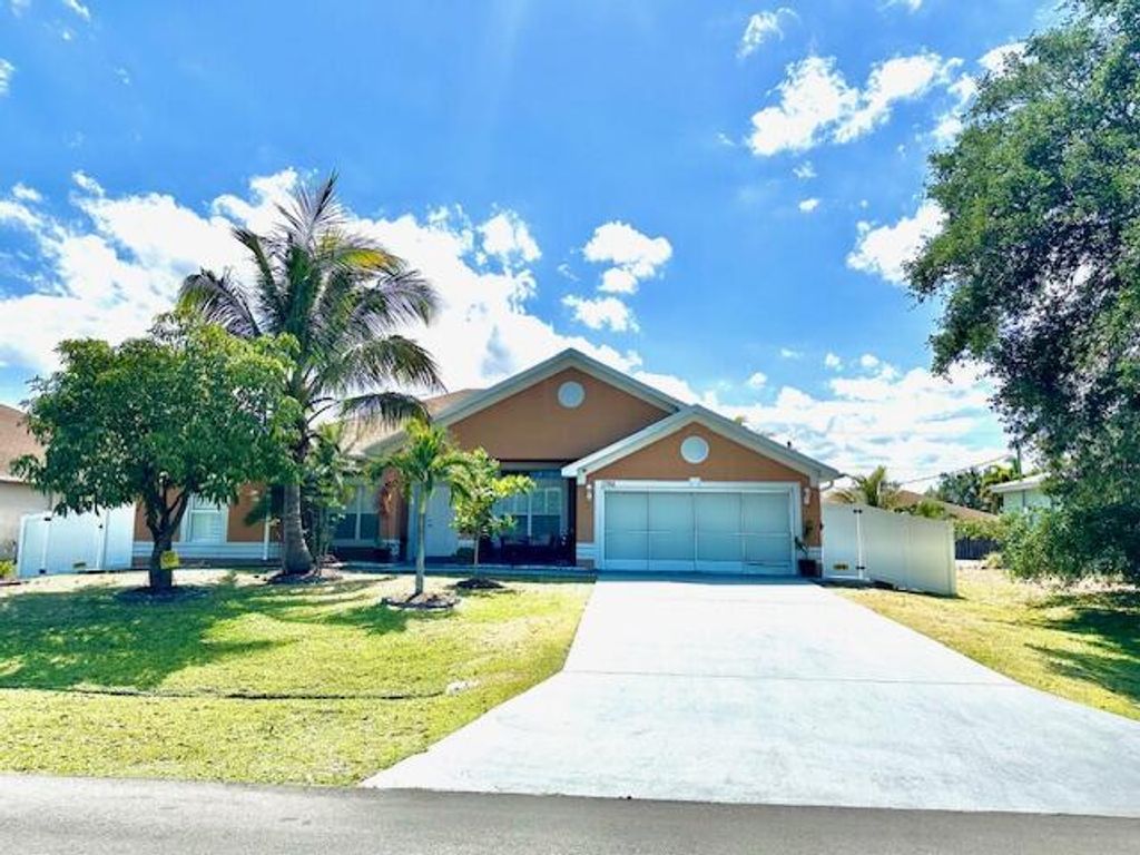 Photo of 1392 SE Odonnell Lane, Port Saint Lucie, FL 34983 (MLS # R10982860)