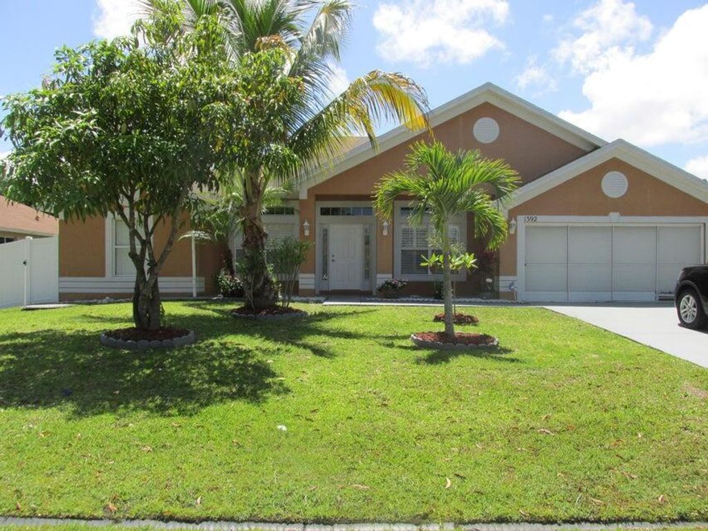 Photo of 1392 SE Odonnell Lane, Port Saint Lucie, FL 34983 (MLS # R10982860)