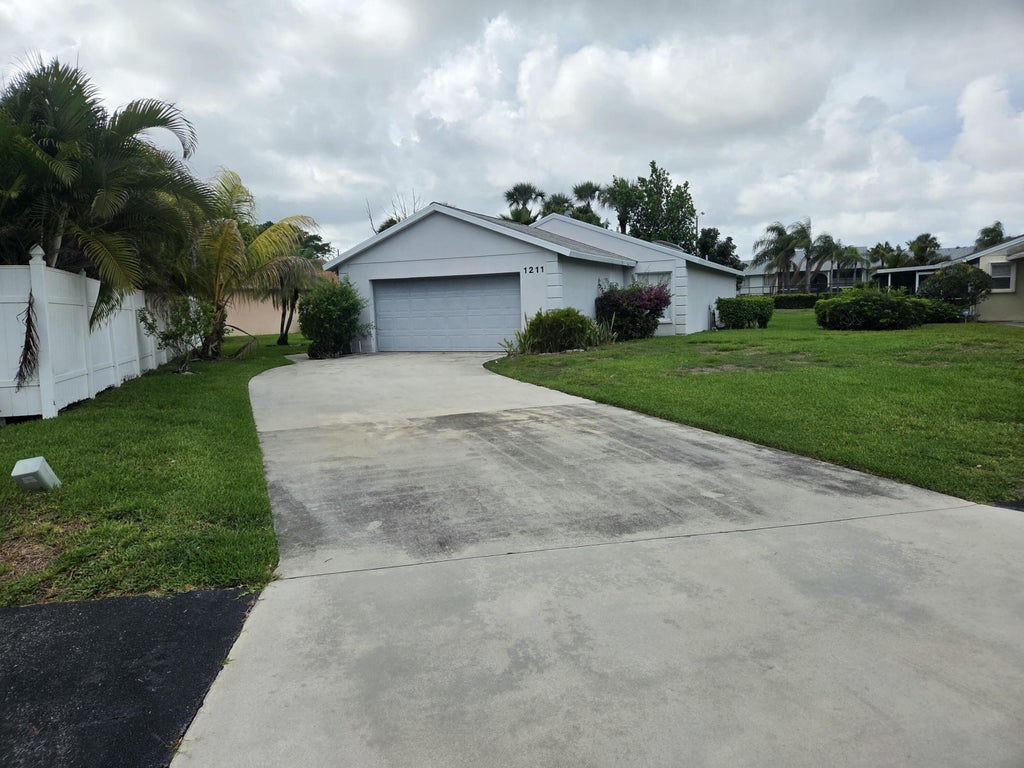 Photo of 1211 Pine Sage Circle, West Palm Beach, FL 33409 (MLS # B26040670)