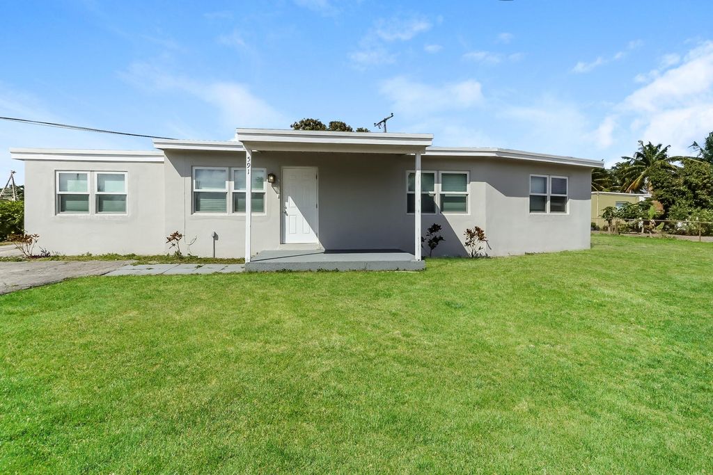 Photo of 591 Seagrape Road, Lake Worth, FL 33462 (MLS # F10501014)