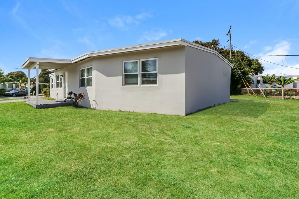 Photo of 591 Seagrape Road, Lake Worth, FL 33462 (MLS # F10501014)