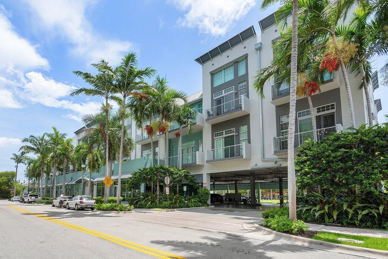 Welcome to Unit 317 at 185 NE 4th Avenue -- a stunning two-story corner penthouse in the highly sought-after Ocean City Lofts, located in the heart of Downtown Delray Beach. This expansive 2-bedroom, 2.5-bathroom loft spans 1,795 square feet and features soaring 20-foot ceilings, polished concrete floors, and floor-to-ceiling impact windows that flood the space with natural light. The open-concept layout showcases a modern kitchen with sleek cabinetry, stainless steel appliances, and a spacious counterspace perfect for entertaining. The first level includes a private guest suite, half bath, and a bright living/dining area that flows onto a large balcony. Upstairs, the versatile loft-style primary suite features a walk-in closet, and a beautifully appointed bathroom.