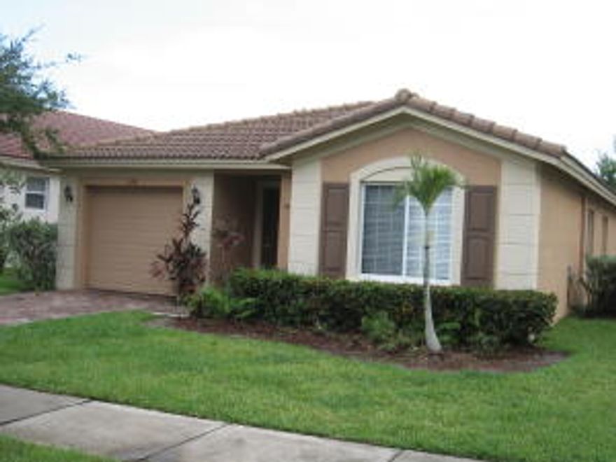 TILED THROUGHOUT LIVING AREAS, NEW CARPET WILL BE INSTALLED IN BEDROOMS. CLEAN ALMOST MOVE IN READY, GRANITE COUNTER TOPS, STAINLESS STEEL APPLIANCES. LAKE VIEWS. EASY ACCESS TO I-95 AND FL TURNPIKE. CLOSE TO POPULAR TRADITION AREA. GOOD SCHOOL ZONE. GATED COMMUNITY, WITH 3 POOLS, FITNESS CENTER, CLUBHOUSE.