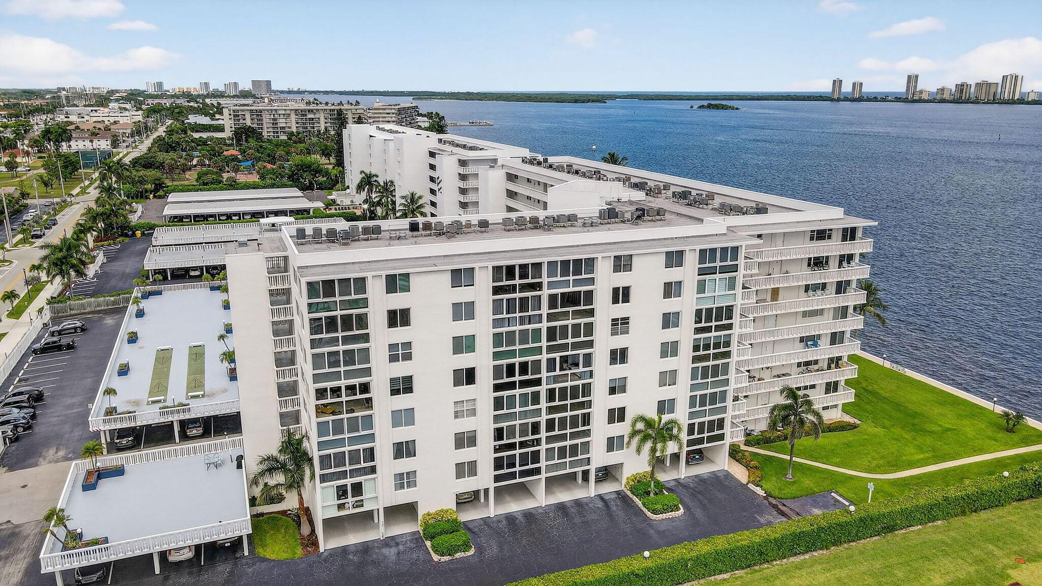 This WATERFRONT, 7th Floor CORNER Unit is Paradise!  Newly renovated 2 yrs ago, it has stunning S, SE and SW views of the ICW, Singer Island and Lake Park Marina. Modern elegance abounds...with French doors opening to the Primary Suite with water-views and walk-in closet. It features Hurricane Impact Windows, state-of-the art Samsung Kitchen Appliances, and Tankless Water Heater. This gated community is located beside the luxurious Nautilus 220, numerous restaurants, Recreational Park with tennis/pickleball and Marina with a boat club and direct access to the ocean!  It's minutes to the beach, PBI airport, shopping Malls and Downtown West Palm Beach. The HOA monthly fee is INCLUSIVE of the Building's Insurance Premiums, unlike other Condo's that bill separately for each.