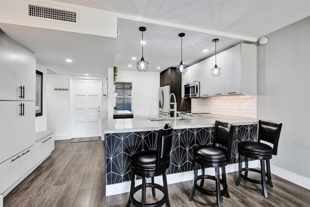 Photo of 3001 S Course Dr #107, Pompano Beach, FL 33069 (MLS # F10537527)