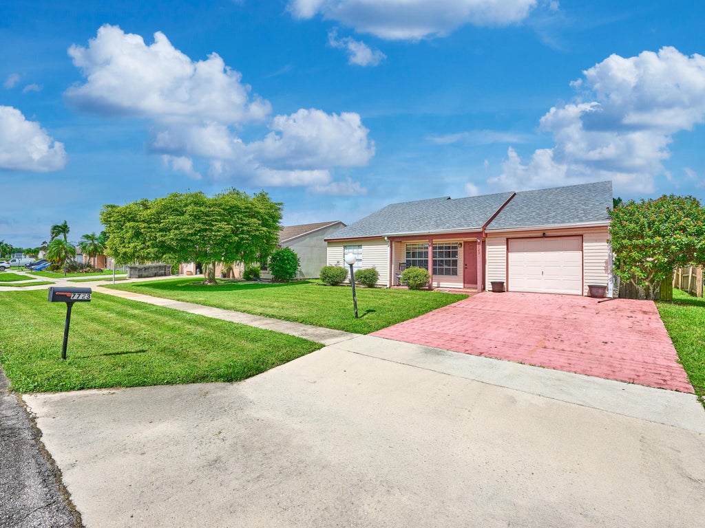 Photo of 7723 CANAL Drive, Lake Worth, FL 33467 (MLS # B26092368)