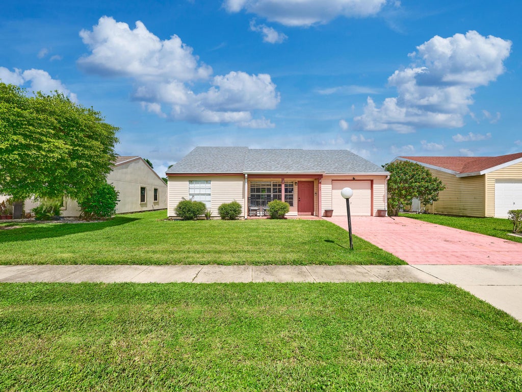 Photo of 7723 CANAL Drive, Lake Worth, FL 33467 (MLS # B26092368)