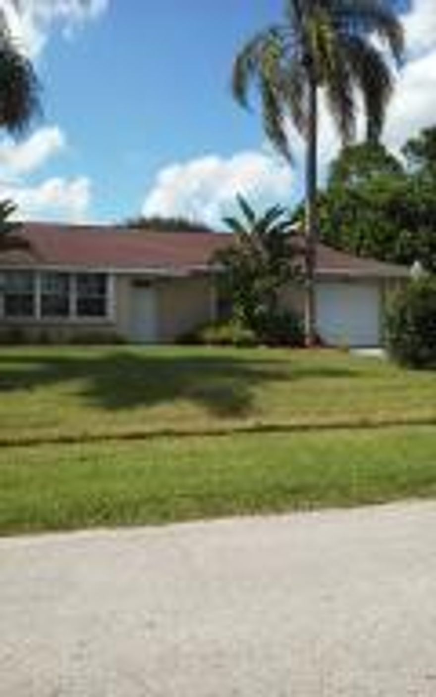 LOVELY HOME REMODELED KITCHEN CABINETS, TILE FLOORS, CARPET IN TWO BEDROOMS, LAMINATE IN MASTER BEDROOM. 12X29 PORCH OVERLOOKING 15X30 PRISTINE SALT WATER SCREENED GUNITE POOL. LOVELY LANDSCAPING, WALK IN CLOSET IN MASTER, STAINLESS APPLIANCES, TILE COUNTERTOP, DESK IN KITCHEN, DUEL SHOWER IN MASTER BATH, HOT TUB. MUST SEE INSIDE. Being sold AS IS but in beautiful condition.