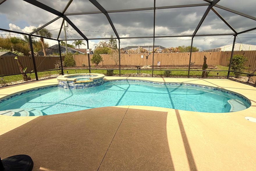 Discover this beautiful 3-bedroom, 2-bath, 2 Garage home built in 2019, with CBS construction. Amazing outdoor space featuring a fully screened POOL, SPA, and PATIO that is perfect for sunbathing, relaxing or entertaining.  Wide open floor plan with lots of light! Great room concept, spacious owner's suite, and a granite kitchen with all appliances. Generously sized guest bedrooms offer plenty of closet space. Inside laundry includes a washer and dryer!! You will love the beautifully landscaped, fully fenced yard with storage SHED and outdoor solar lighting. The home is fully equipped with storm panels and a whole-home, standby generator!!  Top location just minutes to area beaches, shopping, schools and parks/boat ramps. Very quiet street!