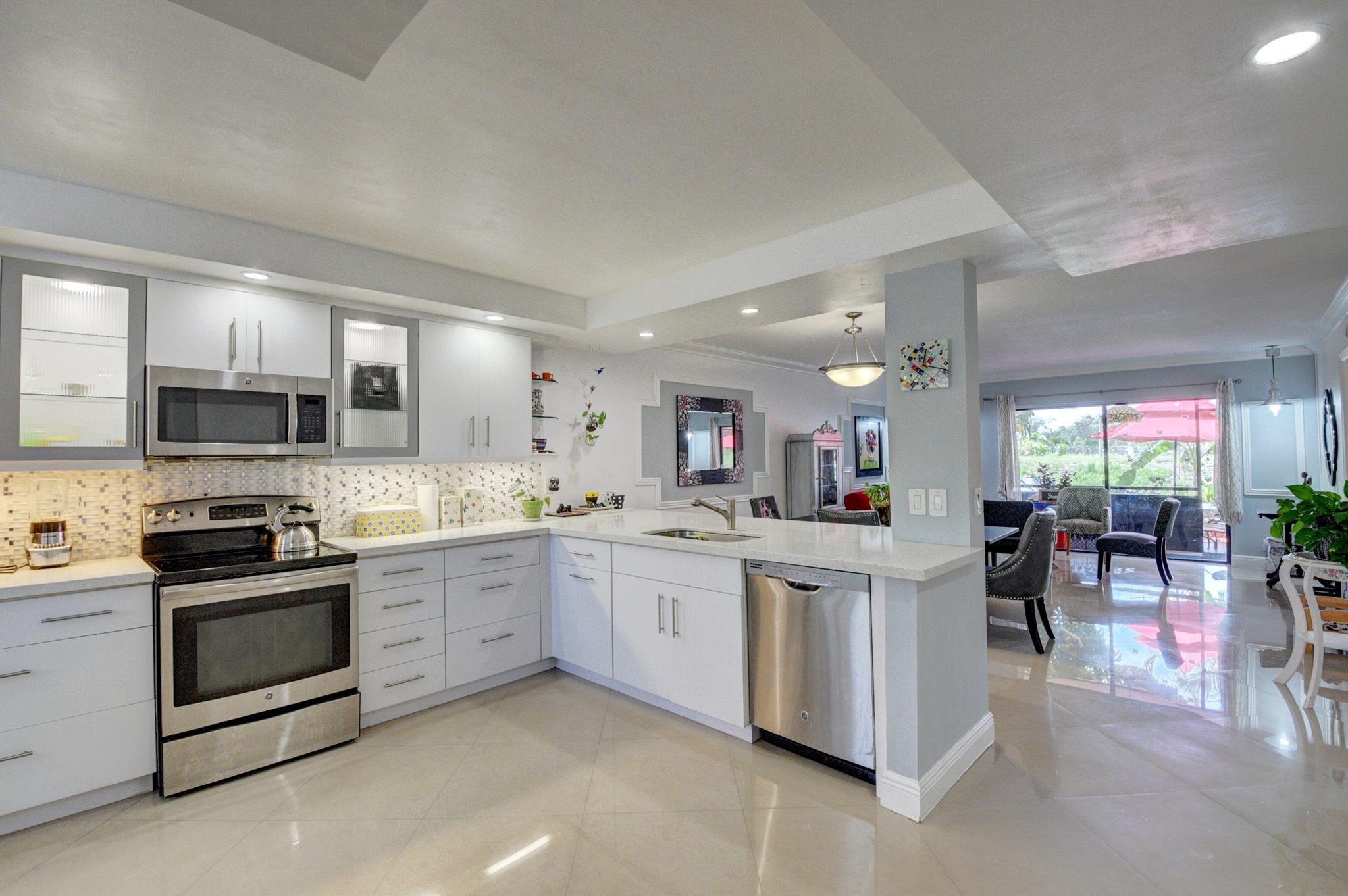 GREAT LOCATION !!! IMMACULATE 2/2 CORNER UNIT CONDO FIRST FLOOR , COMPLETELY REMODELED KITCHEN WITH QUARTZ COUNTER TOPS , ALMOST NEW APPLIANCES, A/C - LAUNDRY ROOM WITH FULL SIZE WASHER AND DRYER . COMMUNITY POOL- CLOSE TO RESTAURANTS AND SHOPPING !!! MUST SEE APPROVAL 2 WEEKS-ONE PET ALLOWED 25LB.