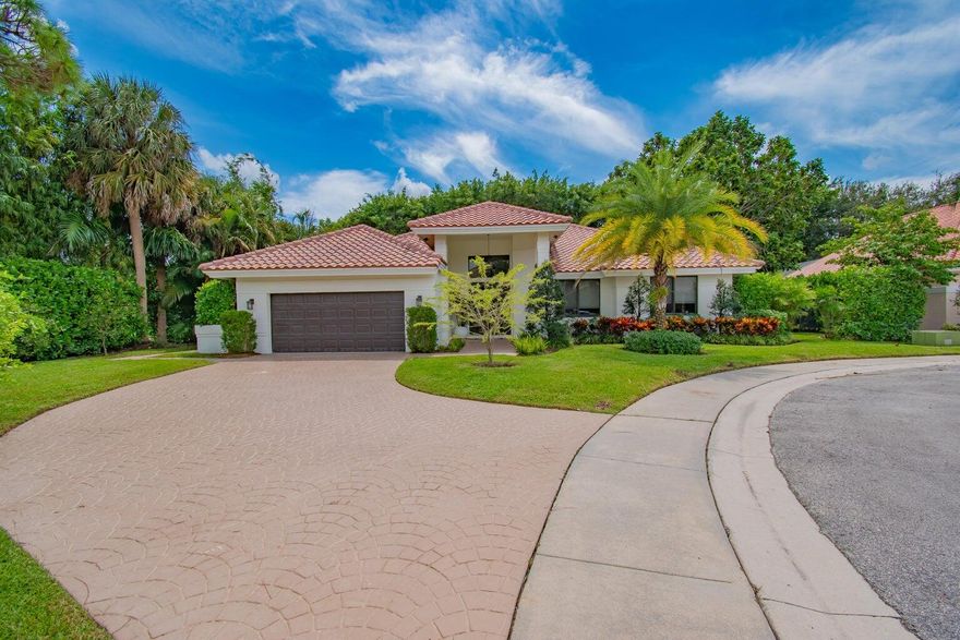 This completely updated home features a modern, warm, clean-line design. Single story East Boca 5 bedroom, 2 1/2 bath, cul-de-sac pool home with 2 car garage in a small private community adjacent to Calusa Elementary School. The front entrance has impressive double 8 foot modern impact doors that open to a grand foyer and large open floor plan with high soaring ceilings. The interior has many windows providing adequate natural light. The Primary Suite includes a large walk-in closet with an elegant bathroom. The kitchen boasts of modern custom cabinetry with quartz counter tops, large island, and like new energy efficient stainless steel appliances. Additional features in supplemental remarks.  A MUST SEE! Additional features include a built in wet bar with beverage cooler, LED lighting, Smart Home switches, tankless water heater, Epoxy coated garage, walk-in pantry, fenced yard, and Hurricane Impact windows/Doors. A++ schools.