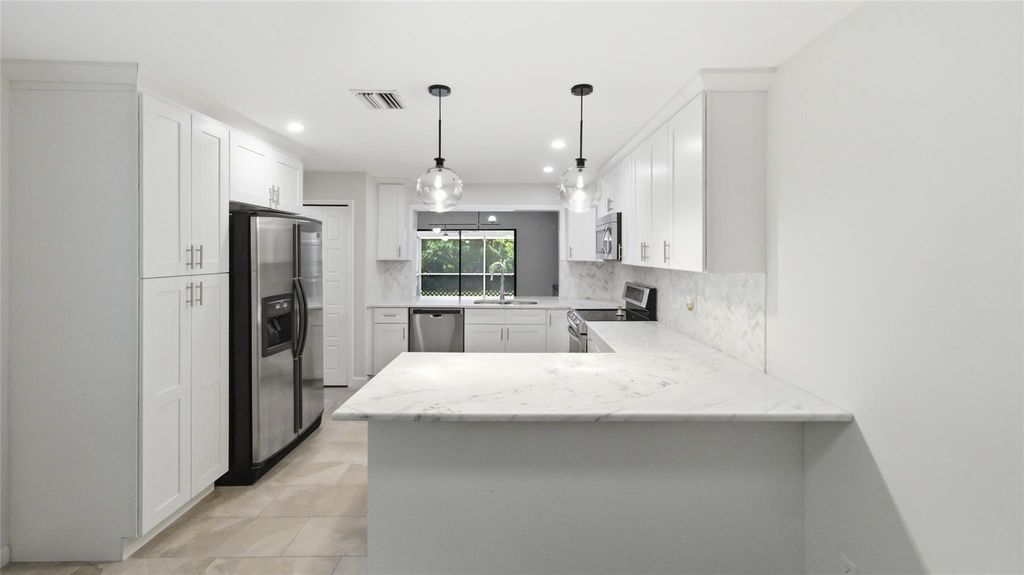 Photo of 619 Deer Creek North Shore Dr #619, Deerfield Beach, FL 33442 (MLS # F10531738)
