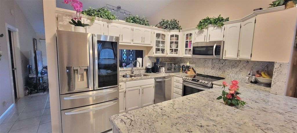 Photo of 1065 NW 50th Drive #1065, Deerfield Beach, FL 33064 (MLS # F10472952)