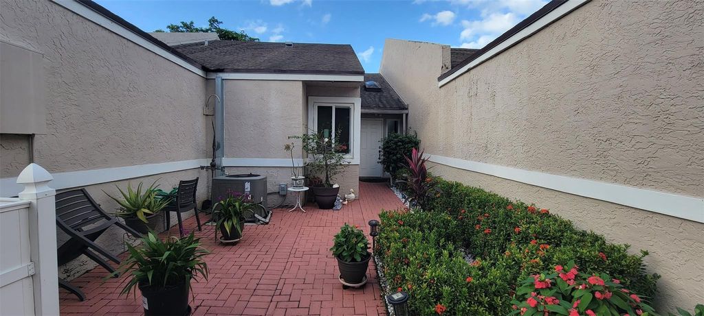 Photo of 1065 NW 50th Drive #1065, Deerfield Beach, FL 33064 (MLS # F10472952)