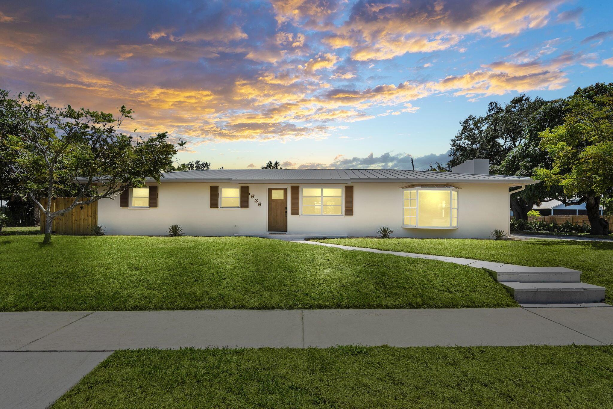 Modern Coastal Living with Endless Potential & NO HOA! This 2,170 sq ft CBS-built property on .3 acres sits just two blocks from the river with deeded neighborhood access. The 3-bed, 2-bath main home showcases designer custom tile finishes, white oak tile floors, and a sleek new kitchen with a quartz waterfall countertop and custom cabinetry, plus a 2025 metal roof, fence, and spa-inspired baths. A unique 1-bed, 1-bath beach bungalow guest house features vaulted ceilings, its own driveway, and complete privacy, perfect for Airbnb income, guests, or in-laws. The expansive lot provides high elevation, no flood insurance required, ample room for boats, RVs, or future additions, all within a quiet neighborhood close to beaches, dining, and shopping.