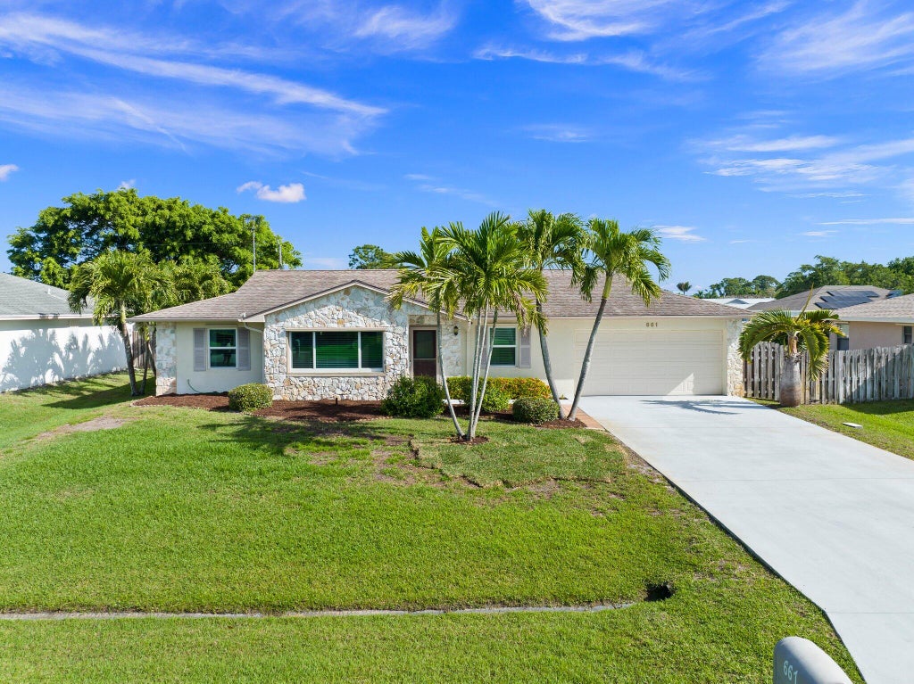 Photo of 661 SE Crescent Avenue, Port Saint Lucie, FL 34984 (MLS # R10972011)