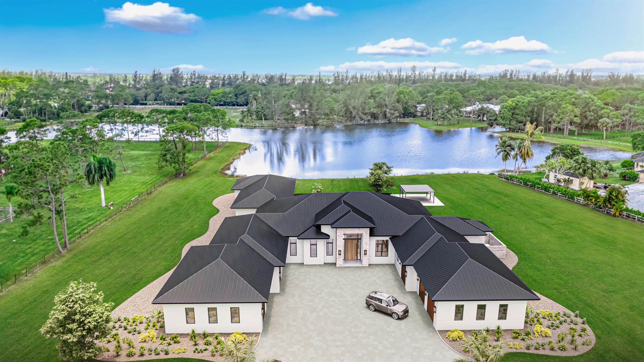 Welcome to Homeland! Gorgeous waterfront new construction in gated equestrian community. 5-acre lot with partial lake. Main house has 6 bedrooms, 5.5 baths, a huge flex room and a 6 car garage. Separate 1,000 SF 2/1 guest house for a total of 12,000 SF under roof. 19-foot foyer, 14-foot ceilings in main area, 12-foot ceilings throughout, including garages. Covered loggia for seamless structure. Magnificent master suite with outdoor shower. Fantastic club room with built-in bar. Salt water heated pool & spa. Top-of-the-line finishes, fixtures and appliances. 1,000 gallon propane tank with 80kW Kohler generator, motorized screens, & fireplaces. Ample room for accessory structures. Potential for finishes customization still available. Property under construction with Winter 2026 delivery.