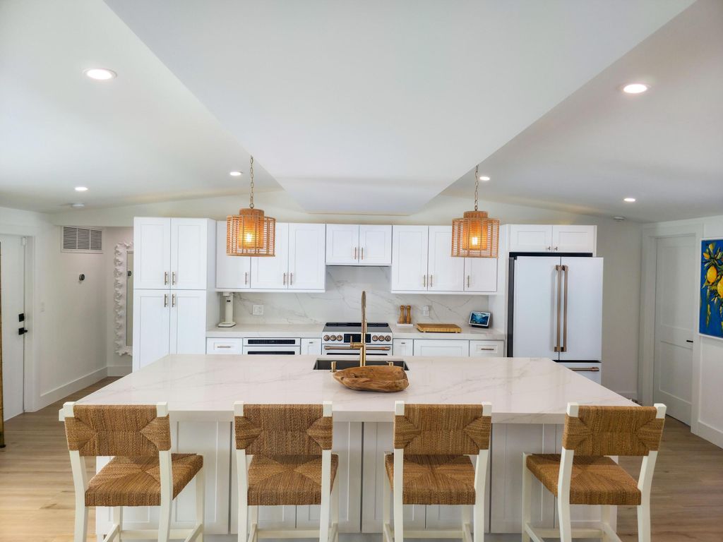 Photo of 720 Eastwind Drive, North Palm Beach, FL 33408 (MLS # R11106933)