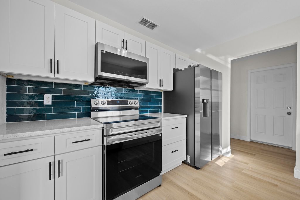 Photo of 1244 W 25th Street, Riviera Beach, FL 33404 (MLS # R11169455)