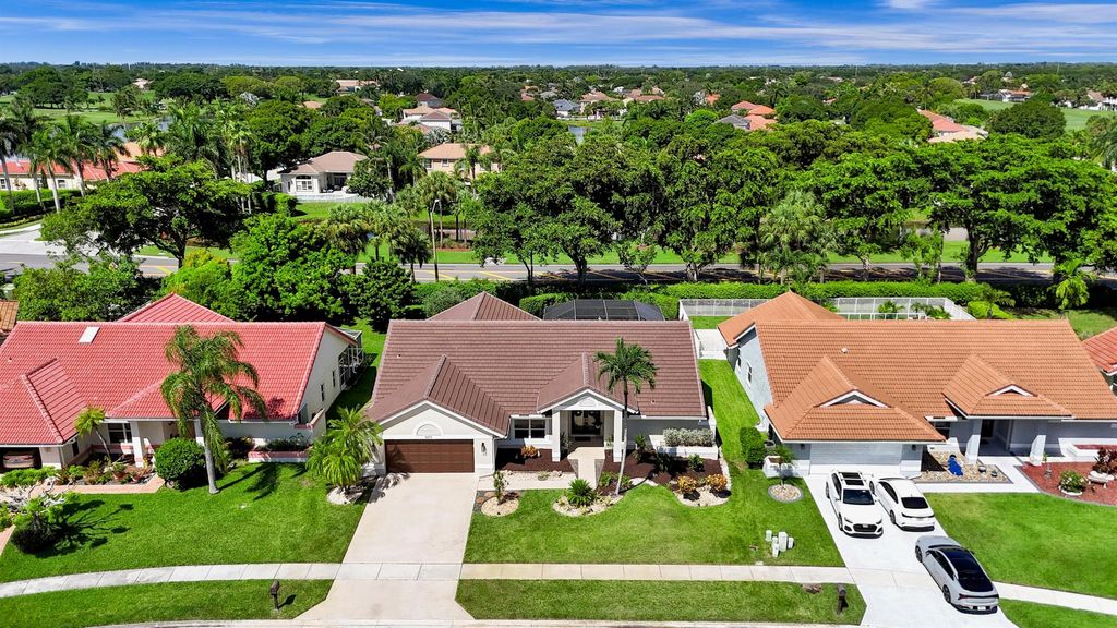 Photo of 5693 Lake Shore Village Circle, Lake Worth, FL 33463 (MLS # R11115820)