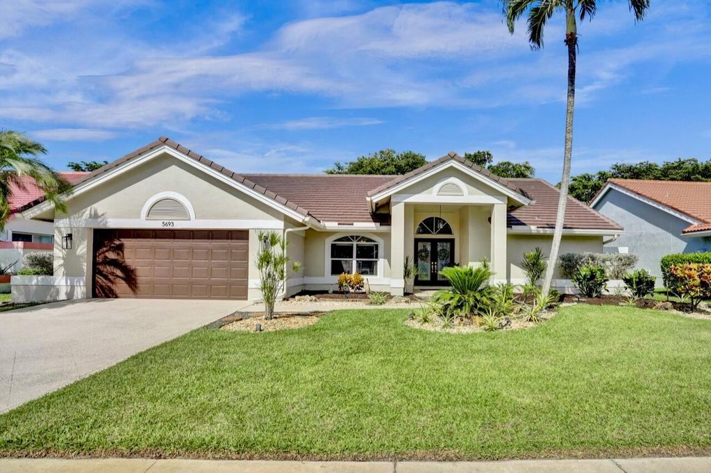 Photo of 5693 Lake Shore Village Circle, Lake Worth, FL 33463 (MLS # R11115820)