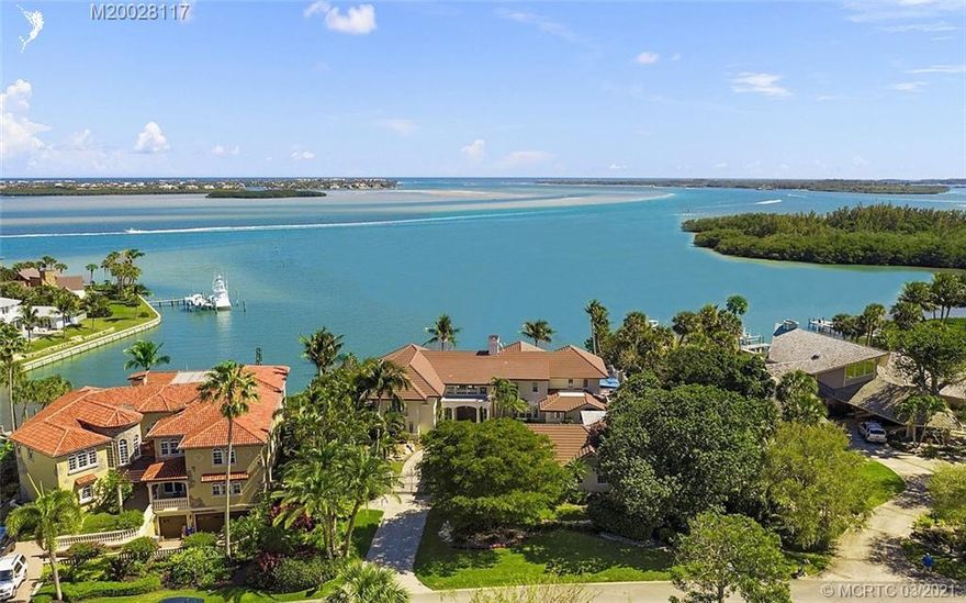 PRICED BELOW RECENT APPRAISAL. Wake up everyday to the most stunning view in all of Martin County, FL! A boater's dream - deep water for your vessel! 135 ft of water frontage! A jewel of High Point, this magnificent residence sits high atop a bluff offering awe-inspiring vistas of the St Lucie River, the St Lucie Inlet and the Atlantic Ocean beyond. Enter into your expansive living room with soaring 20' ceilings, a master wing w/ balcony, 4 additional en-suite bedrooms, a gourmet kitchen, dining room, family room, wine cellar, 2 elevators, 3 car garage with attached separate guest suite, complete impact glass & a pub style bar room that sets the standard for home entertaining! Step outdoors onto your expansive coral terrace leading to a private pool/hot tub & outdoor kitchen.