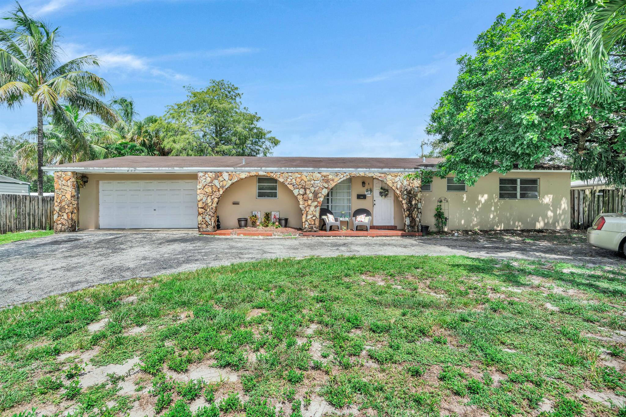 4-bedroom, 2-bathroom single-family home sits on a large lot with a circular driveway and tons of curb appeal!Step inside to find expansive living space, perfect for entertaining and comfortable everyday living. The home features oversized living and dining areas, a cozy family room, a functional eat-in kitchen, and ample natural light throughout. Enjoy a private backyard with lush greenery and plenty of space for a pool or outdoor entertainment area!With just a little TLC or updating, this home has endless potential to become a showstopper! LOCATION! Just 1 minute to the Florida Turnpike, seconds from Broward Blvd, and minutes to the Hard Rock Casino, I-95, Broward Mall, Downtown Ft. Lauderdale, Las Olas, and major airports (FLL, MIA, PBI)!