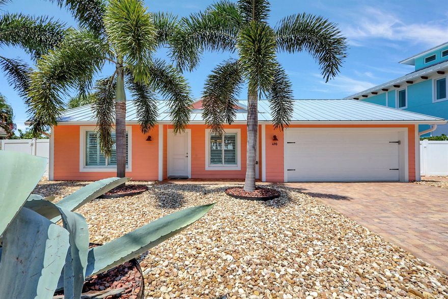 Tropical oasis! This meticulously updated CBS 3 bedroom, 2 bathroom home is located on a deep, ocean access canal, boasting custom finishes, with high end kitchen appliances, quartz countertops, custom cabinets, porcelain plank wood tile flooring, crown molding throughout, impact windows and doors, plantation shutters, roller shades on sliding doors, interior LED lighting. 2015 standing seam metal roof. 2023 A/C unit with microbial ductwork, Icynene insulation (average electric bill $133.00 per month.) The beautifully manicured grounds include two motorized awnings, with brick pavers in the driveway and backyard, and a privacy fence. No fixed bridges. The neighborhood park has a community boat launch. Voluntary annual HOA of $100/$50 boat ramp fee.