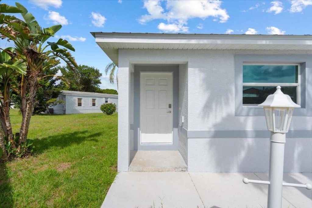 Photo of 15 Jacaranda Lane, Port Saint Lucie, FL 34952 (MLS # R11090483)